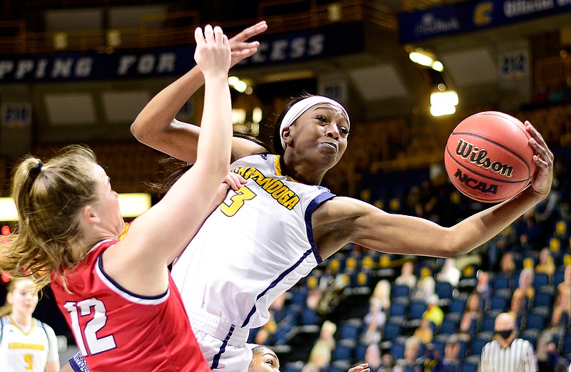 Staff photo by Robin Rudd / UTC's Eboni Williams pulls in an offensive rebound against Samford's Mallory Hampton during Saturday's game at McKenzie Arena. Williams grabbed a game-high 14 rebounds and scored 15 points as the Mocs won 70-57 two days after losing by 11 to the same team.