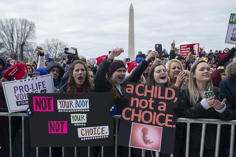 FILE - In this Jan. 24, 2020, file photo, supporters cheer as President Donald Trump speaks during the annual "March for Life" rally on the National Mall, in Washington. Anti-abortion leaders across America were elated a year ago when Donald Trump became the first sitting U.S. president to appear in person at their highest-profile annual event, the March for Life held every January. The mood is more sober now — a mix of disappointment over Trump's defeat and hope that his legacy of judicial appointments will lead to future court victories limiting abortion rights. (AP Photo/ Evan Vucci, File)


