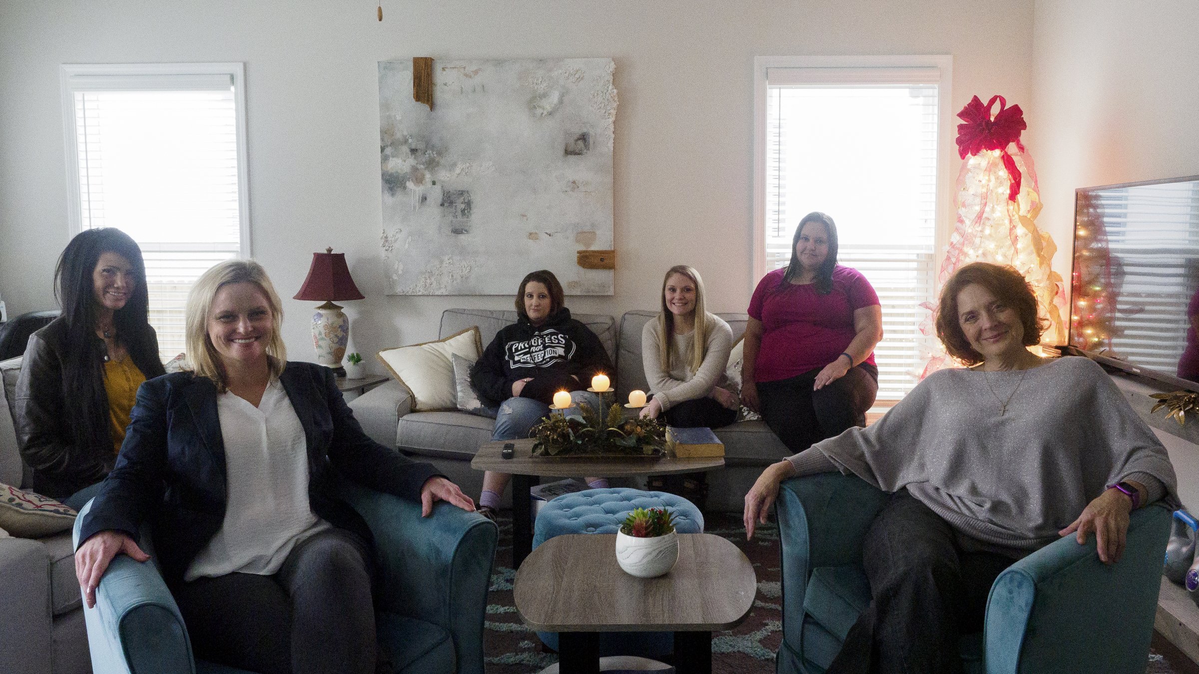 Staff photo by C.B. Schmelter / From left, Holly Webb, Ashley Harrison, Michele Cornelius, Kaitlyn Beeler, Mallory Hardeman and manager Kelli Webber pose in the meeting area at The Launch Pad.