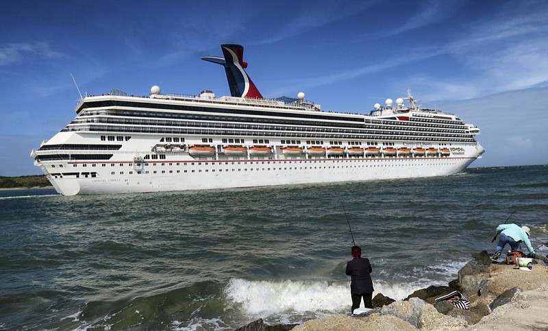 FILE - In this March 9, 2020 photo, the Carnival Liberty leaves Port Canaveral, Fla. Carnival Cruise Line said Monday, Jan. 25, 2021, is cancelling and delaying more U.S. sailings as it continues to suffer from the pandemic's fallout. (Joe Burbank/Orlando Sentinel via AP, File)