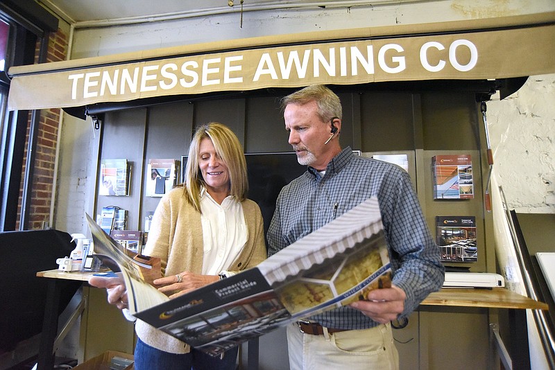 Staff Photo by Matt Hamilton / Co-owners Amy Clinton and Brent Songer work together at Tennessee Awning Co.