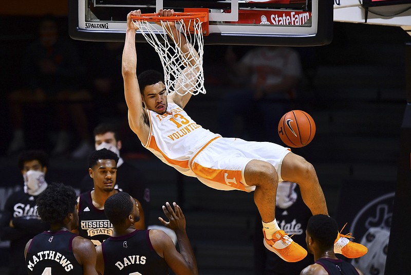 Tennessee forward Olivier Nkamhoua dunks during the team's NCAA college basketball game against Mississippi State on Tuesday, Jan. 26, 2021, in Knoxville, Tenn. (Brianna Paciorka/Knoxville News Sentinel via AP, Pool)
