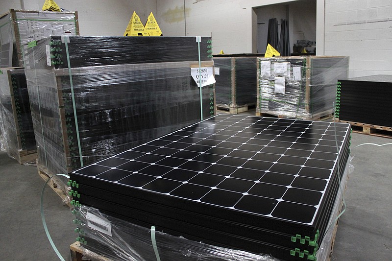 FILE This March 9, 2016 file photo shows the latest generation of SunPower solar panels that are stacked in Positive Energy Solar's warehouse in Albuquerque, N.M. The future looks bright for solar and other renewable energy technology. The sector should benefit from a much friendlier administration in the White House. (AP Photo/Susan Montoya Bryan, File)