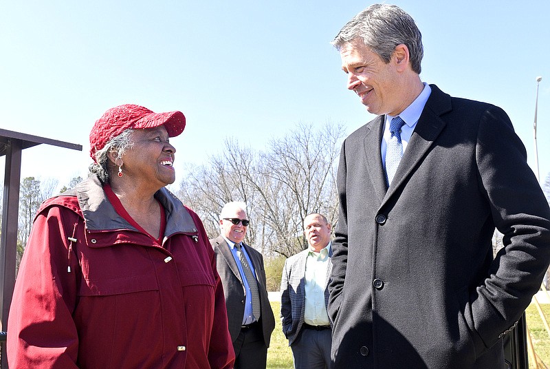 Staff File Photo By Robin Rudd / Chattanooga Mayor Andy Berke speaks with Community Council member Armelia Williams after a groundbreaking for road improvements in 2020.