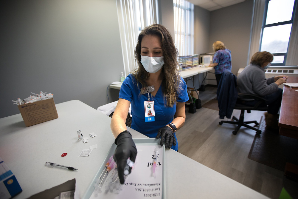 Staff photo by Troy Stolt / RN Lauren Dean fills syringes with the Moderna COVID-19 vaccine inside of the pharmacy at the Hamilton County Health Department's new COVID Vaccination POD at the CARTA Bus Terminal on Thursday, Jan. 28, 2021 in Chattanooga, Tenn.