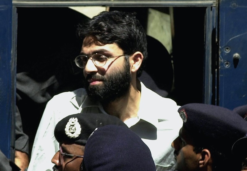 FILE - In this March 29, 2002 file photo, Ahmed Omar Saeed Sheikh, the alleged mastermind behind Wall Street Journal reporter Daniel Pearl's kidnap-slaying, appears at the court in Karachi, Pakistan. Pakistan's Supreme Court on Thursday, Jan. 28, 2021 has ordered the release of Ahmed Omar Saeed Sheikh convicted and later acquitted in the gruesome beheading of American journalist Daniel Pearl in 2002. The court also dismissed an appeal of Ahmad Saeed Omar Sheikh's acquittal by Pearl's family. (AP Photo/Zia Mazhar, File)