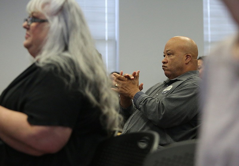 Staff photo by Erin O. Smith / Monty Bruell claps along with others after Hamilton County Schools Superintendent Bryan Johnson finishes speaking during the State of the Schools address at the Hamilton County PTA Council meeting at the Hamilton County Department of Education board room Monday, October 21, 2019 in Chattanooga, Tennessee. Bruell was already running for Chattanooga mayor and went to the meeting to learn what is going on with the school system.