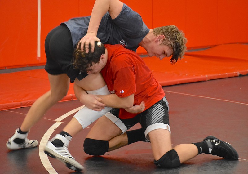 Staff photo by Patrick MacCoon / Signal Mountain senior wrestlers Kevin Muschel, top, and Preston Worley are two-time state runners-up who hope to finish their high school careers as champions.