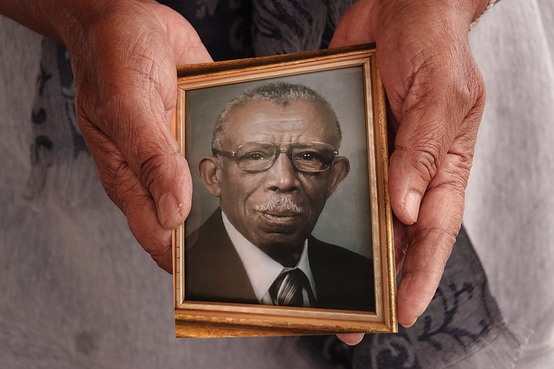 Joyce Christian of Somerville, Tennessee holds a photo of her father Freddie Lee Tyson. She is a retired nurse who wants to encourage people in the African American community to take the Covid-19 vaccine. Her father, was unknowingly a part of the Tuskegee syphilis study. What happened to her father, led to the establishment of biomedical ethics committees. These committees were established to set ethical criteria to ensure what happened to her fathers would not happen again./Photo by © Karen Pulfer Focht/Tennessee Lookout