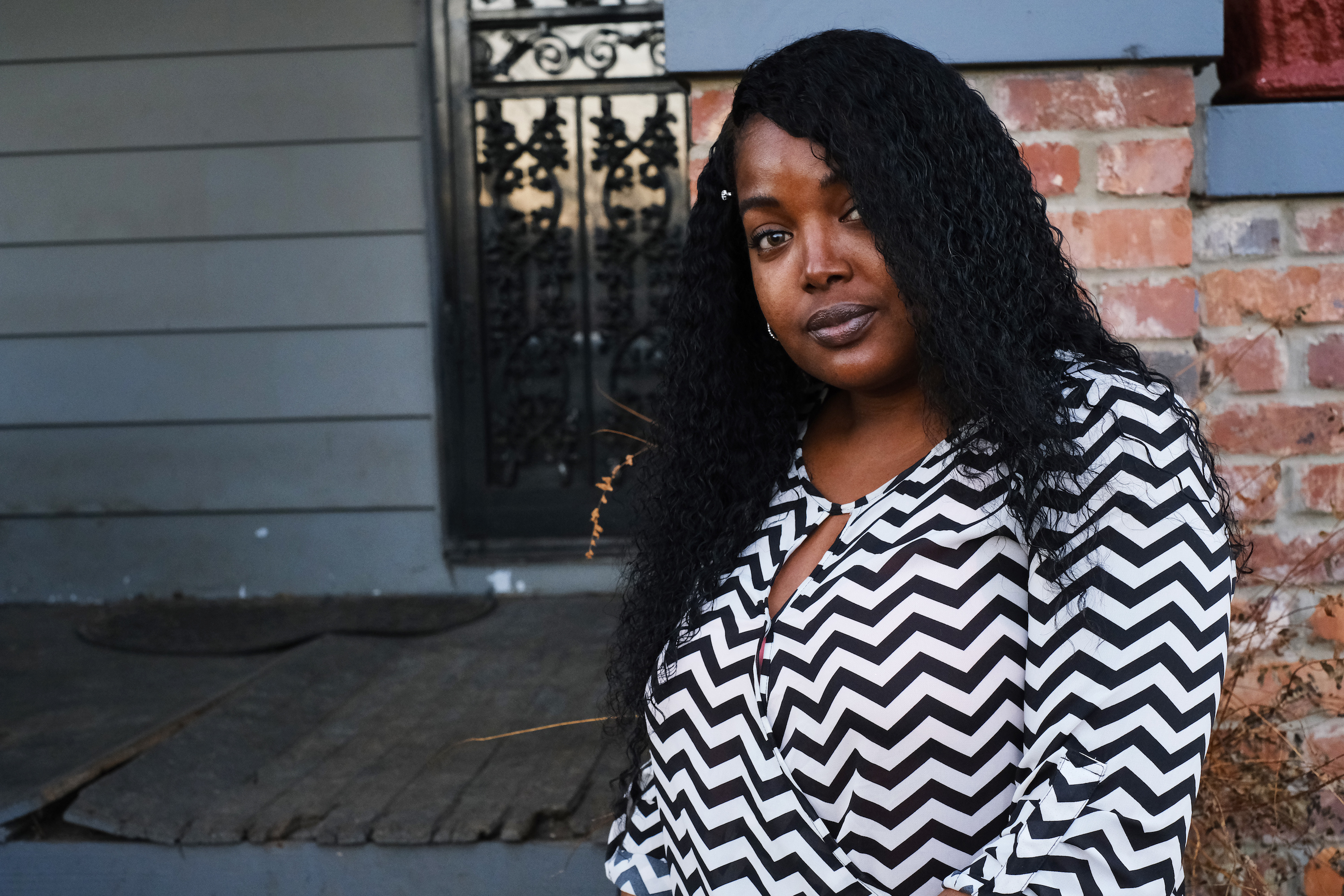 Staff photo by Wyatt Massey / Zapouria Lewis sits outside her Chattanooga home on Jan. 29, 2021. Lewis lost her 20-year-old daughter to COVID-19 in Nov. 2020 and believes people need to take the virus more seriously since people like her daughter, who had a developmental disability, are more at risk for severe or deadly infections.
