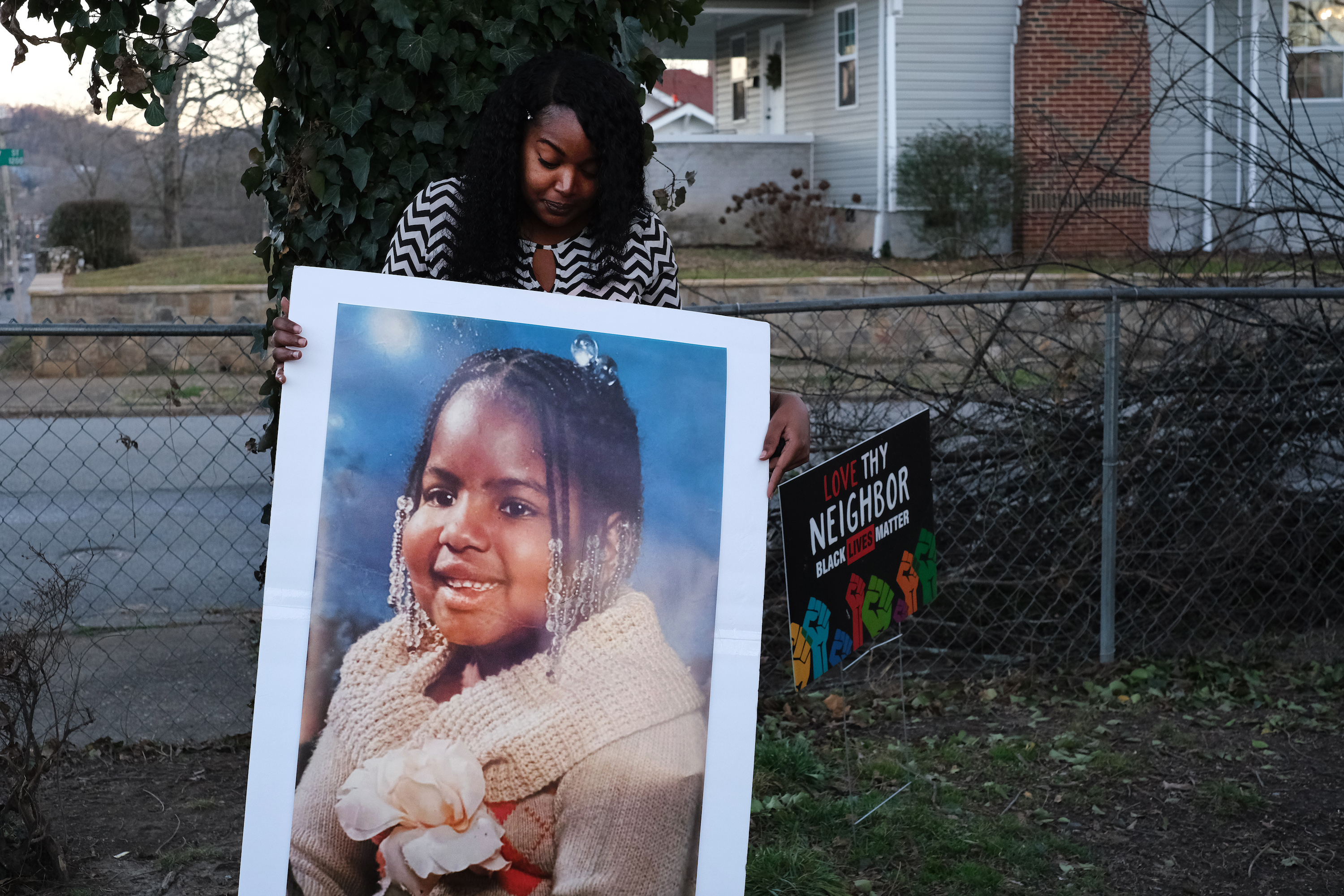 Staff photo by Wyatt Massey / Zapouria Lewis holds a photo of her daughter Nautika Lewis on Jan. 29, 2021 outside her Chattanooga home. Nautika, who had Prader-Willi syndrome, died of COVID-19 at age 20 in Nov. 2020.
