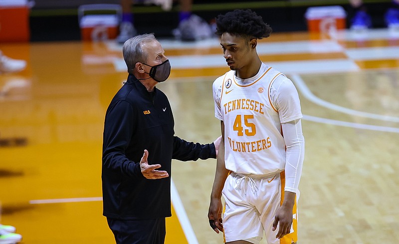 Randy Sartin/USA Today Sports / Tennessee basketball coach Rick Barnes talks with freshman guard Keon Johnson during Saturday night's 80-61 whipping of Kansas inside Thompson-Boling Arena.