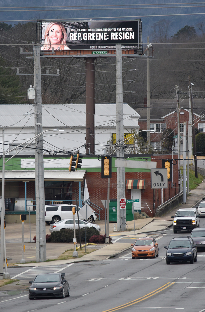 Staff Photo by Matt Hamilton / An electronic billboard at the intersection of Thornton and W. Walnut Avenues urges Rep. Marjorie Taylor Greene to resign on Monday, Feb. 1, 2021.
