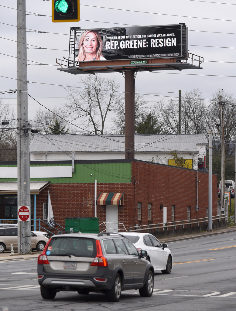 Staff Photo by Matt Hamilton / An electronic billboard at the intersection of Thornton and W. Walnut Avenues urges Rep. Marjorie Taylor Greene to resign on Monday, Feb. 1, 2021.