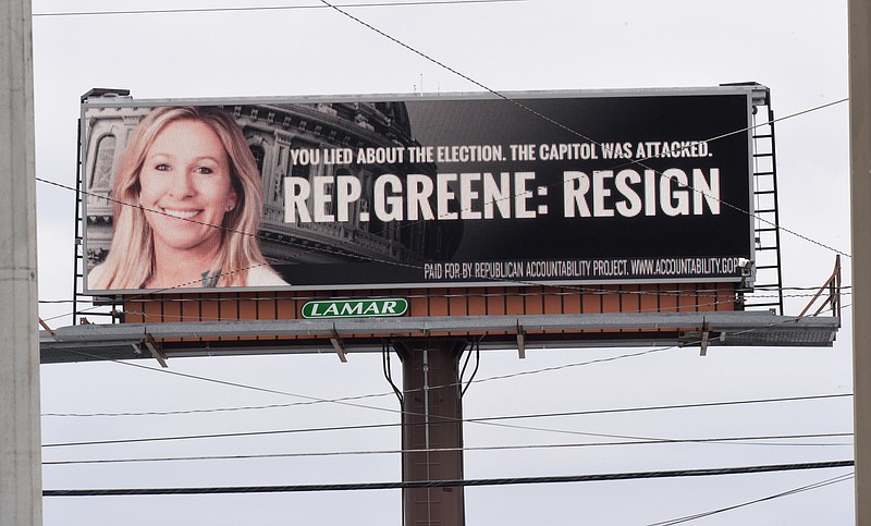 Staff Photo by Matt Hamilton / An electronic billboard at the intersection of Thornton and W. Walnut Avenues urges Rep. Marjorie Taylor Greene to resign on Monday, Feb. 1, 2021.