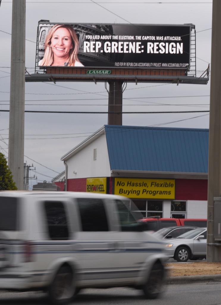Staff Photo by Matt Hamilton / An electronic billboard at the intersection of Thornton and W. Walnut Avenues urges Rep. Marjorie Taylor Greene to resign on Monday, Feb. 1, 2021.