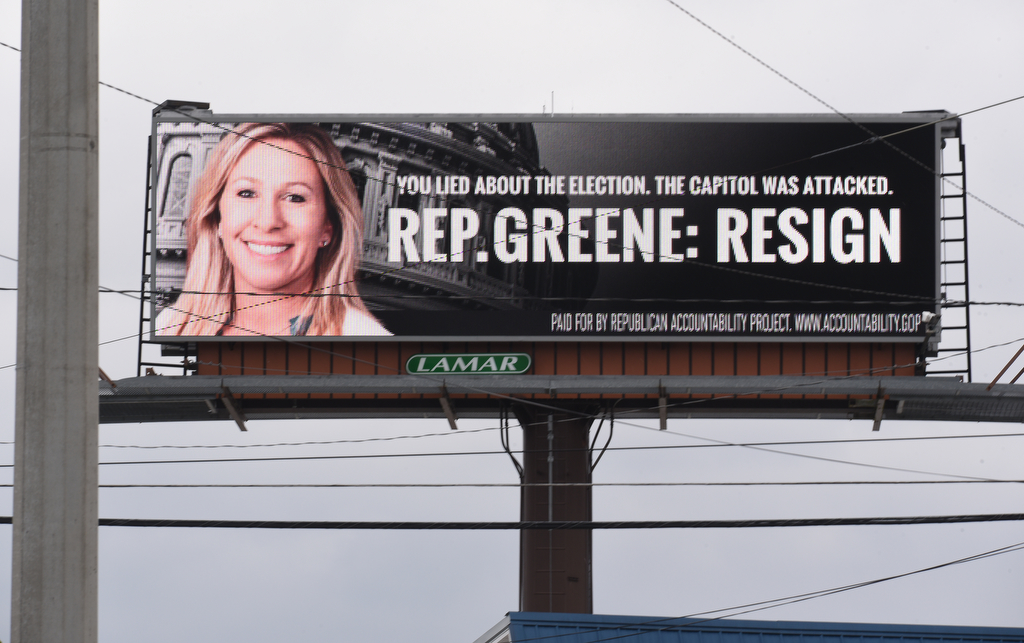 Staff Photo by Matt Hamilton / An electronic billboard at the intersection of Thornton and W. Walnut Avenues urges Rep. Marjorie Taylor Greene to resign on Monday, Feb. 1, 2021.
