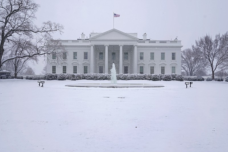 Snow falls on the North Lawn of the White House, Sunday, Jan. 31, 2021, in Washington. (AP Photo/Patrick Semansky)