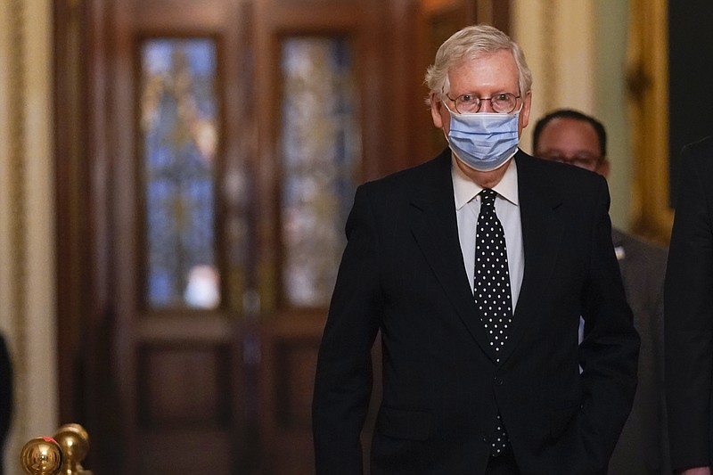 AP file Photo by Manuel Balce Ceneta/In this Jan. 6, 2021, photo, former Senate Majority Leader Mitch McConnell walks from the Senate floor to his office on Capitol Hill.