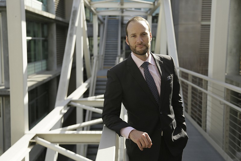 Photo by Eric Risberg of The Associated Press / San Francisco District Attorney Chesa Boudin poses outside his office in San Francisco on Jan. 30, 2020. Boudin took office as district attorney in San Francisco a year ago as part of a politically progressive wave of prosecutors committed to seeking restorative justice over mass incarceration.