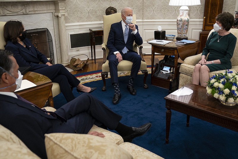 President Joe Biden and Vice President Kamala Harris meet with Republican lawmakers to discuss a coronavirus relief package, in the Oval Office of the White House, Monday, Feb. 1, 2021, in Washington. From left, Sen. Mitt Romney, R-Utah, Vice President Kamala Harris, Biden, and Sen. Susan Collins, R-Maine. (AP Photo/Evan Vucci)