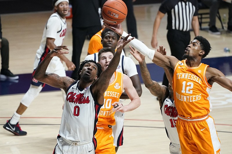Tennessee guard Victor Bailey Jr. (12) pulls away a rebound from Mississippi forward Romello White (0) during the first half of an NCAA college basketball game in Oxford, Miss., Tuesday, Feb. 2, 2021. (AP Photo/Rogelio V. Solis)


