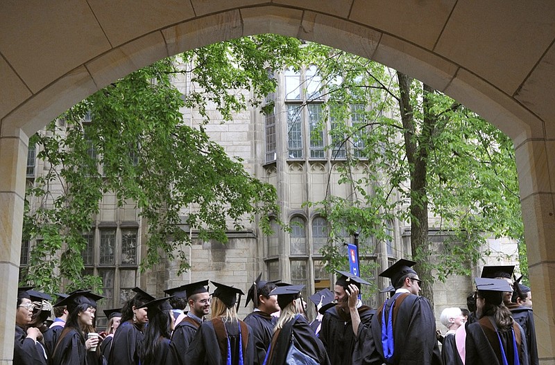 FILE - In this May 24, 2010 file photo, future graduates wait for the procession to begin for commencement at Yale University in New Haven, Conn. The Biden Justice Department says it is dismissing its discrimination lawsuit against Yale University. The Trump administration alleged last year that the university was illegally discriminating against Asian American and white applicants. On Feb. 3, 2021, the Justice Department noted in its filing that it was voluntarily dismissing the action. (AP Photo/Jessica Hill, File)

