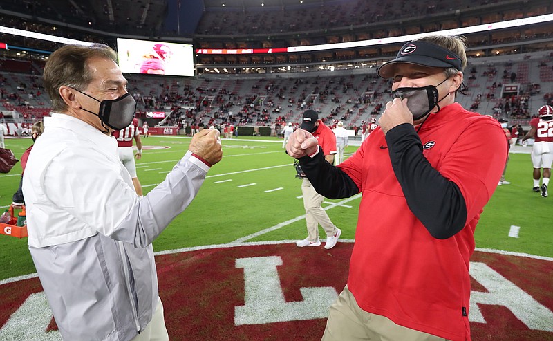 Crimson Tide photos / Alabama football coach Nick Saban and Georgia counterpart Kirby Smart share a laugh before the Crimson Tide's 41-24 victory in Bryant-Denny Stadium on Oct. 17. Saban and Smart have since landed top-three signing classes but are ready to get back on the road to see prospects.