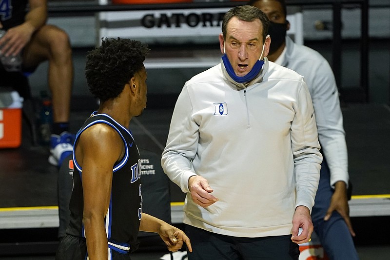 AP photo by Marta Lavandier / Duke men's basketball coach Mike Krzyzewski talks to guard Jeremy Roach during the second half of Monday's game at Miami.