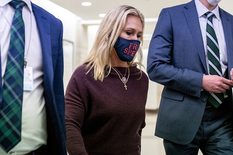 Rep. Marjorie Taylor Greene, R-Ga., walks back to her office after speaking on the floor of the House Chamber on Capitol Hill in Washington, Thursday, Feb. 4, 2021. (AP Photo/Andrew Harnik)