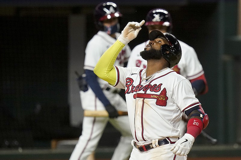 AP photo by Eric Gay / The Atlanta Braves' Marcell Ozuna celebrates after hitting a home run against the Los Angeles Dodgers during Game 4 of the NLCS on Oct. 15 in Arlington, Texas.