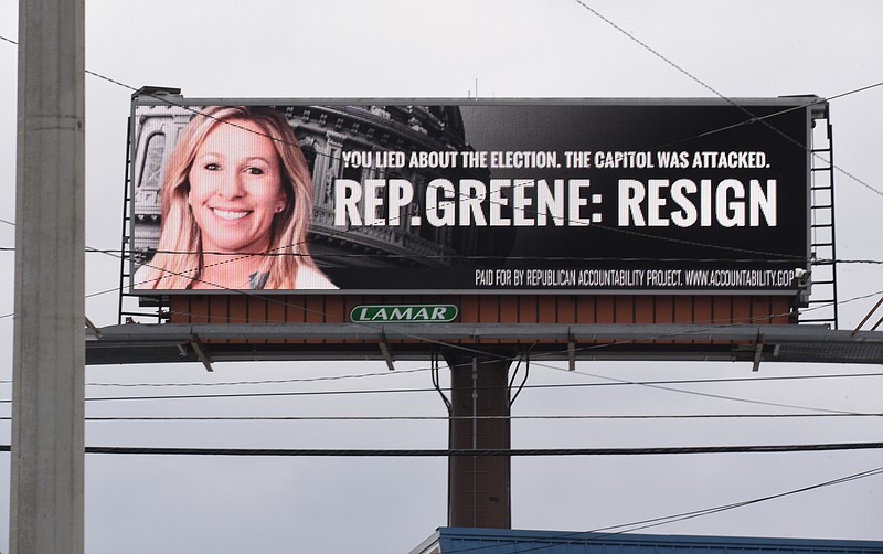 Staff Photo by Matt Hamilton / An electronic billboard at the intersection of Thornton and W. Walnut Avenues urges Rep. Marjorie Taylor Greene to resign on Monday, Feb. 1, 2021. 