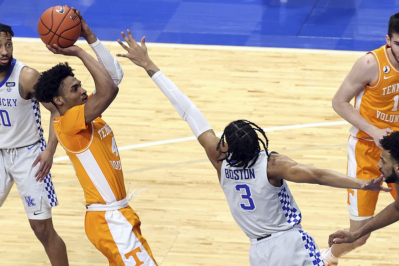 AP photo by James Crisp / Tennessee's Keon Johnson shoots over Kentucky's B.J. Boston during the first half Saturday night in Lexington, Ky.