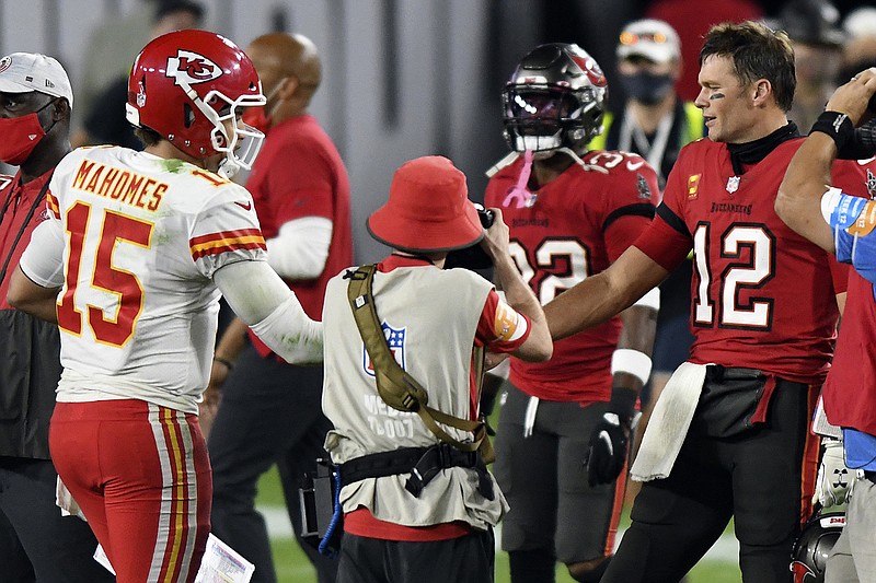 AP photo by Jason Behnken / Tampa Bay Buccaneers quarterback Tom Brady (12) congratulates Kansas City Chiefs counterpart Patrick Mahomes after a regular-season game on Nov. 29 in Tampa, Fla. The Chiefs won 27-24 that day, and they'll be back at Raymond James Stadium on Sunday night, when the Bucs will become the first team to play a Super Bowl in its home stadium.