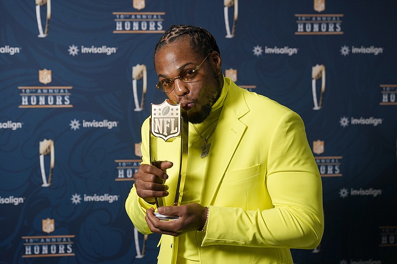 AP photo by Charlie Riedel / Tennessee Titans running back Derrick Henry poses with his award as the league's top offensive player for the 2020 season during the NFL Honors ceremony.