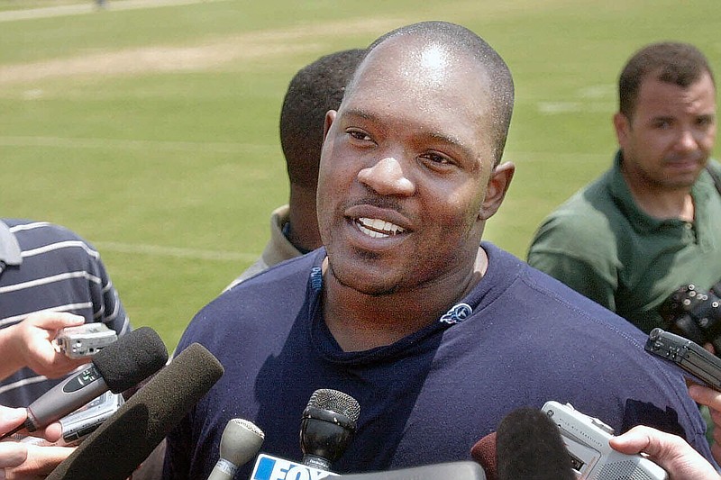 AP photo by John Russell / Tennessee Titans defensive tackle Josh Evans talks with reporters after practice on May 17, 2001, in Nashville.