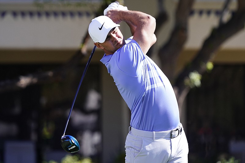 AP photo by Rick Scuteri / Brooks Koepka tees off on the fifth hole at TPC Scottsdale during Sunday's final round of the Waste Management Phoenix Open. Koepka closed with a 65 for a one-shot victory, his eighth on the PGA Tour.