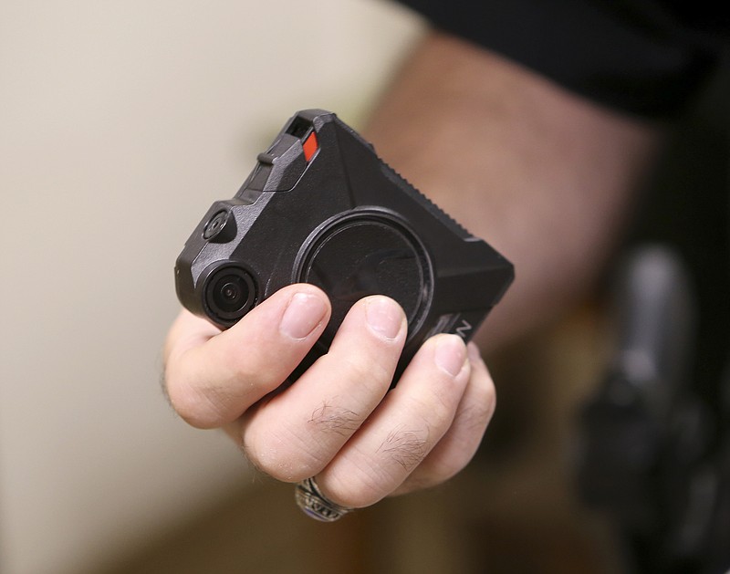 Staff photo by C.B. Schmelter / Chattanooga Police Lt. Mark Smeltzer holds a body camera in this 2017 file photo. Catoosa County recently approved the purchase of body-worn cameras and car cameras for its Sheriff's Office.