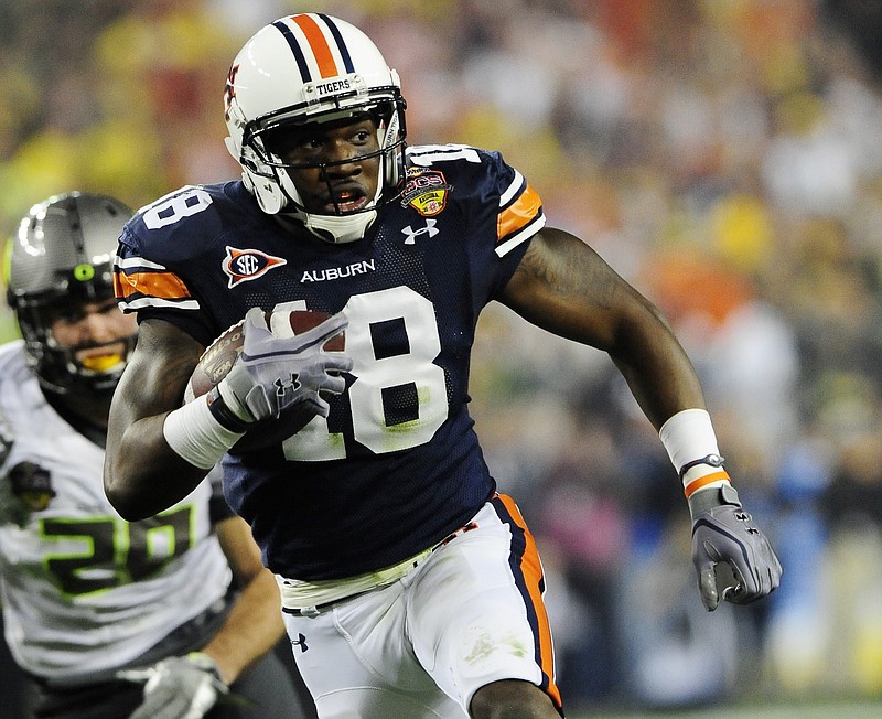 Auburn photo by Todd Van Emst / Kodi Burns, expected to be the new receivers coach at Tennessee, was a receiver on Auburn's 2010 national championship team and coached Auburn's receivers the past five seasons.