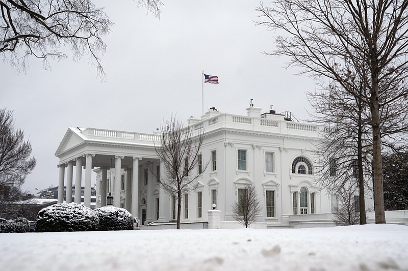 In this Feb. 1, 2021, photo, snow covers the ground at the White House in Washington. Only a fragment of Americans believe democracy is thriving in the U.S., even as broad majorities agree that representative government is one of the country's bedrock principles, according to a new poll from The Associated Press-NORC Center for Public Affairs Research. Just 16% of Americans say democracy is working well or extremely well, a pessimism that spans the political spectrum. (AP Photo/Evan Vucci)

