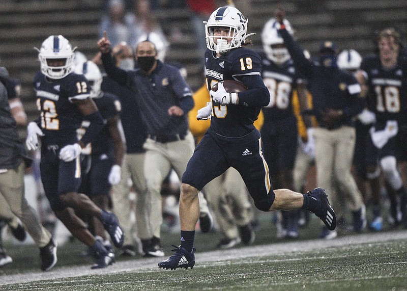 Staff photo by Troy Stolt / Chattanooga Mocs wide receiver Bryce Nunnelly (19) returns a kickoff for a touchdown during the second half of the Chattanooga Mocs football game against the Western Kentucky Hilltoppers at Houchens Industries-L.T. Smith Stadium on Saturday, Oct. 24, 2020 in Bowling Green , Kentucky. The referees called the touchdown back, saying Chattanooga Mocs wide receiver Tyrin Summers (9) called for a fair catch in the end zone before Nunnelly received the ball and the Mocs would lose the game 10-13.