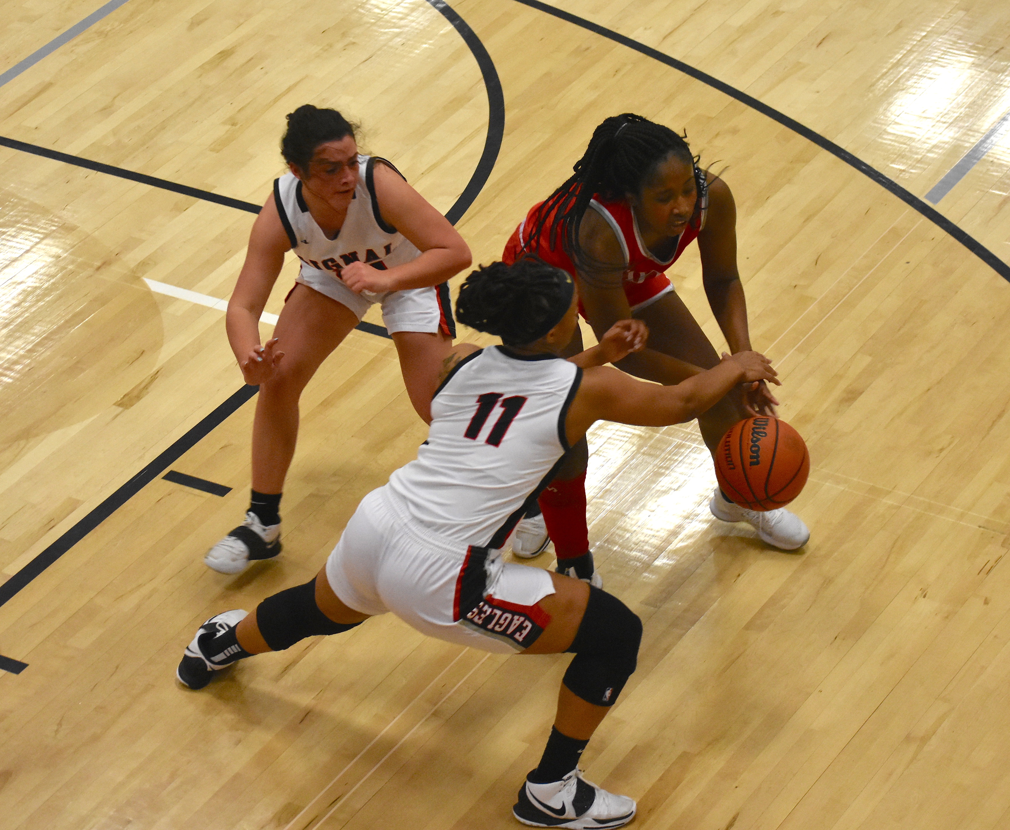 Staff photo by Patrick MacCoon / Signal Mountain's Jaylah Hardy goes for the ball while defending Baylor standout and Wake Forest signee Raegyn Conley. Hardy scored 12 points and had four assists and steals in Monday's home win for the Lady Eagles.