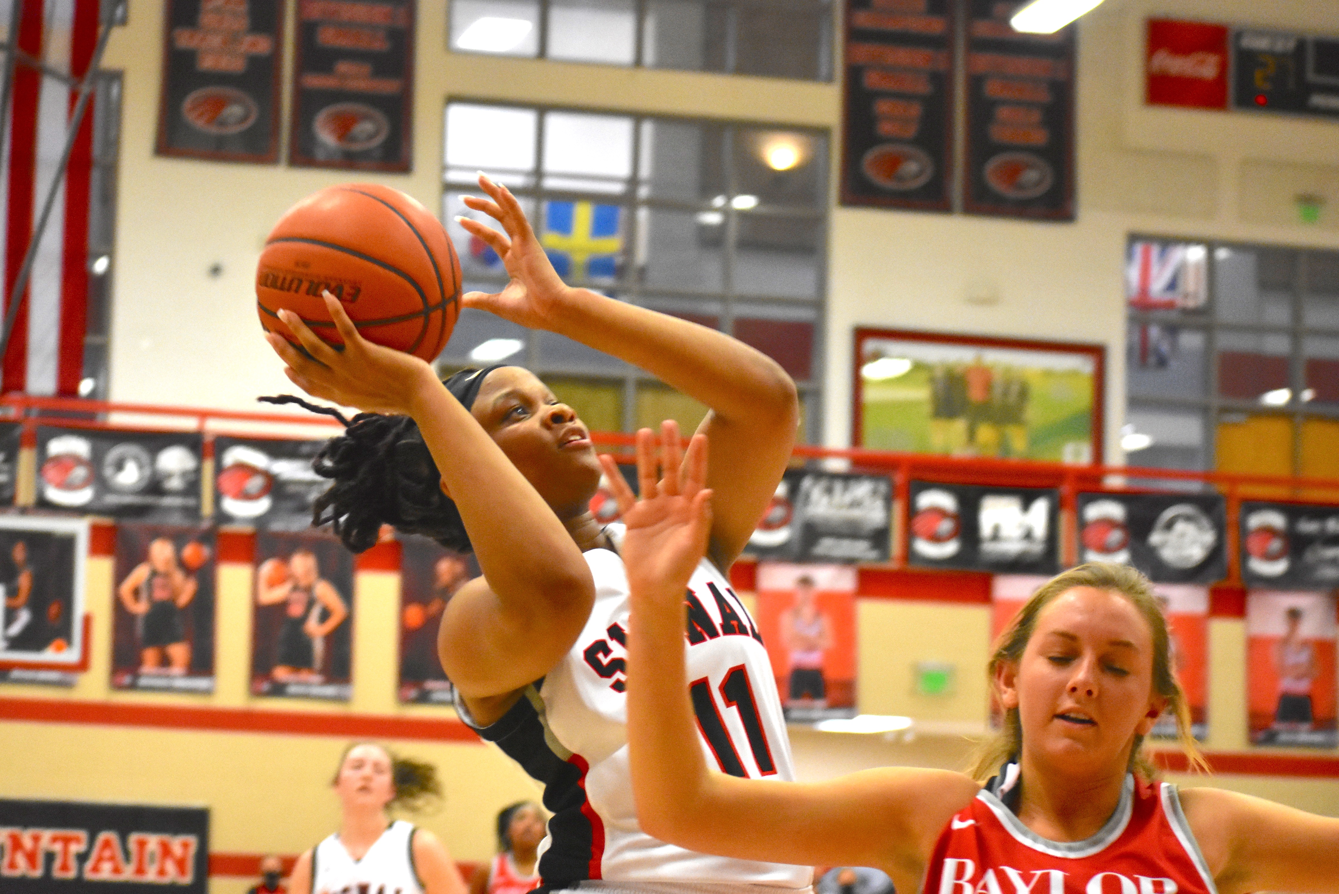 Staff photo by Patrick MacCoon / Signal Mountain senior Jaylah Hardy scores while driving to the hoop in Tuesday's home victory over Baylor.