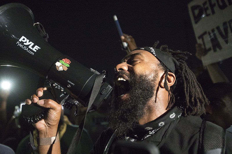 Staff photo by Troy Stolt / Protester C-Grimey addresses demonstrators in the courtyard of College Hill Courts during a demonstration on Wednesday, June 3, 2020, in Chattanooga, Tenn., protesting the death of George Floyd in Minneapolis.