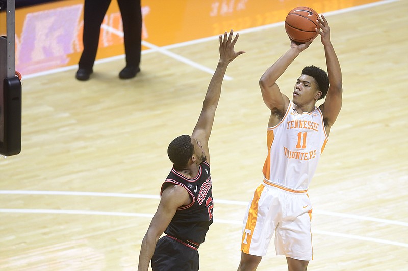 Knoxville News Sentinel photo by Caitie McMekin via AP / Tennessee guard Jaden Springer shoots while guarded by Georgia's P.J. Home during Wednesday night's game in Knoxville.