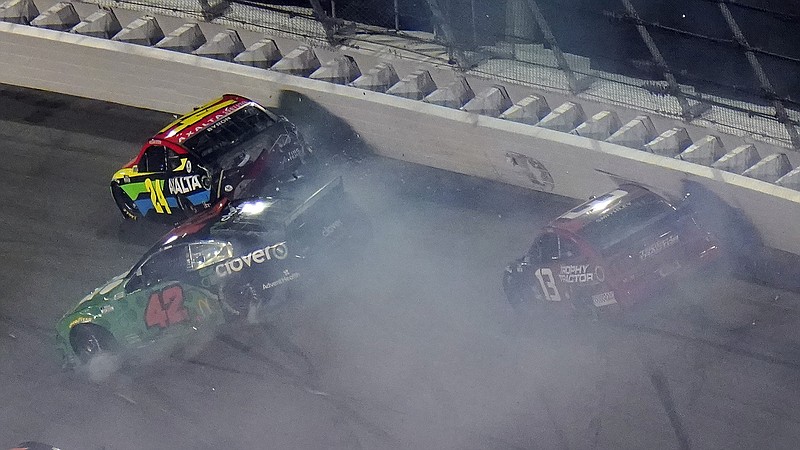 AP photo by Chris O'Meara / William Byron (24), Ross Chastain (42), and Garrett Smithley crash Thursday night at Daytona International Speedway during the second of two qualifying races for Sunday's Daytona 500.