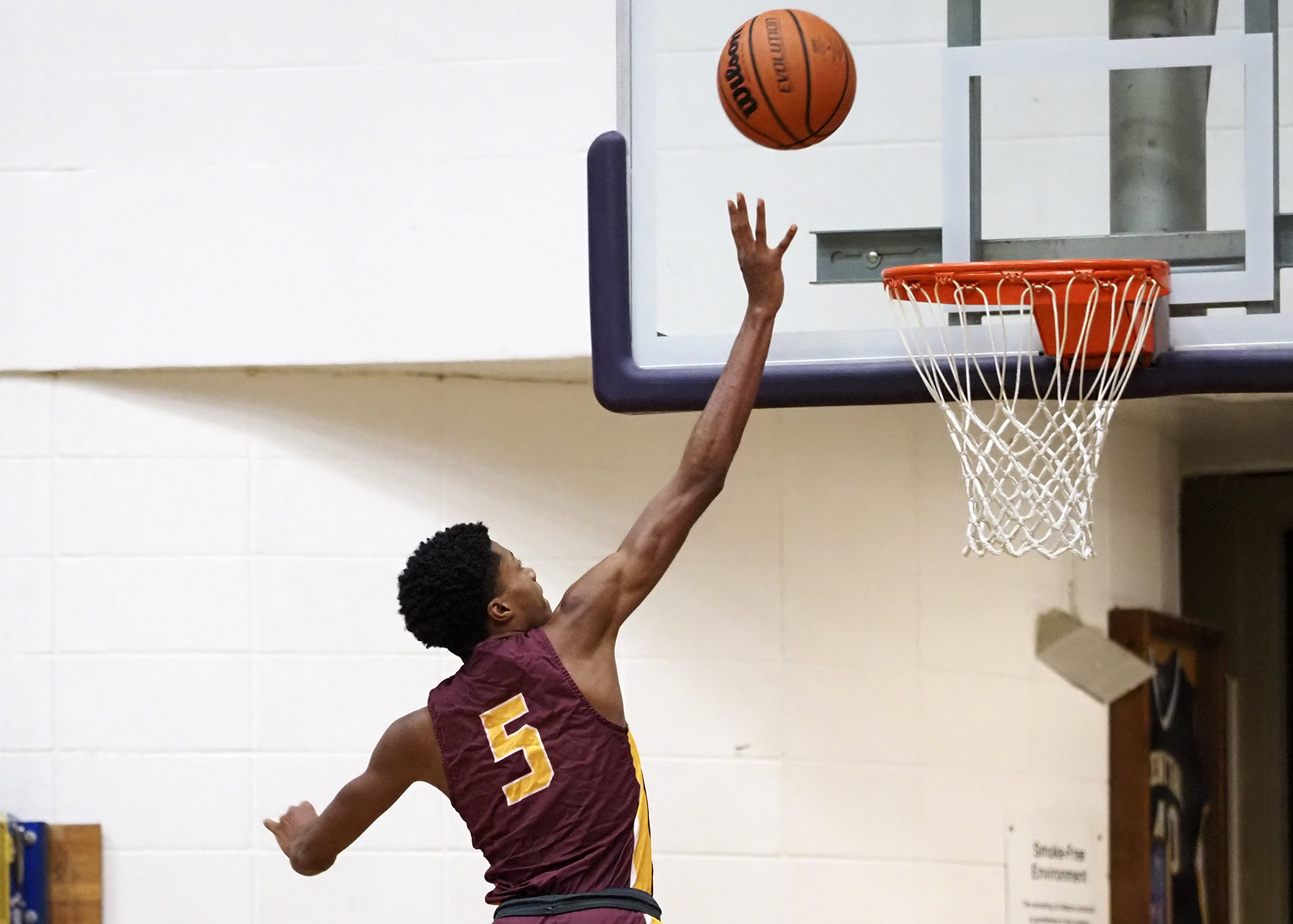 Staff photo by C.B. Schmelter / Tyner's Javontay Ross (5) attempts to lay the ball in against Central at Central High School on Friday, Feb. 12, 2021 in Chattanooga, Tenn.