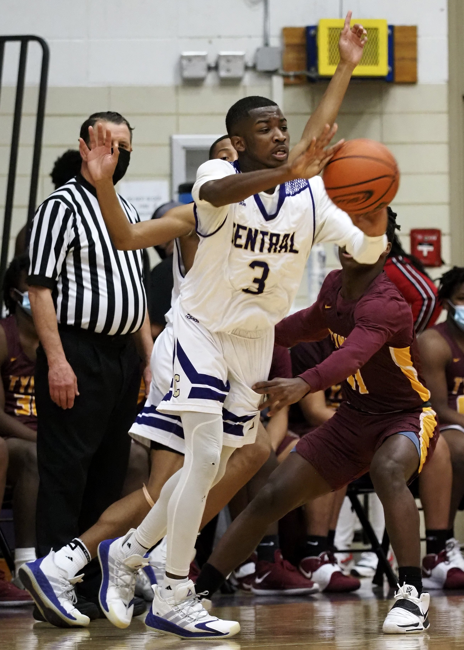Staff photo by C.B. Schmelter / Central's Kenneth Steward (3) passes the ball against Tyner at Central High School on Friday, Feb. 12, 2021 in Chattanooga, Tenn.