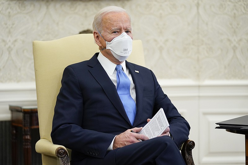 President Joe Biden speaks during a meeting with a bipartisan group of mayors and governors to discuss a coronavirus relief package, in the Oval Office of the White House, Friday, Feb. 12, 2021, in Washington. (AP Photo/Evan Vucci)