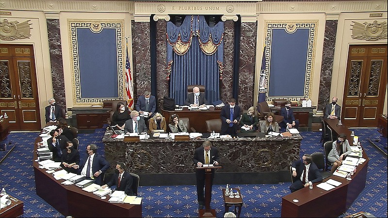 In this image from video, Michael van der Veen, an attorney for former President Donald Trump, listens as the clerk read a question from Sen. Bill Cassidy, R-La., during the second impeachment trial of former President Donald Trump in the Senate at the U.S. Capitol in Washington, Friday, Feb. 12, 2021. (Senate Television via AP)